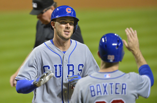 Chicago Cubs third baseman Kris Bryant, left, celebrates his grand slam in the ninth inning against the Cleveland Indians at Progressive Field in Cleveland on June 17, 2015. (David Richard-USA TOD ...