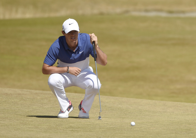 Jun 21, 2015; University Place, WA, USA; Rory McIlroy lines up a putt on the 14th green in the final round of the 2015 U.S. Open golf tournament at Chambers Bay. (John David Mercer-USA TODAY Sports)