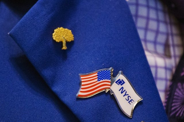 Pins are displayed on a trader's jacket as he works on the floor of the New York Stock Exchange, New York, June 16, 2015.( REUTERS/Lucas Jackson)