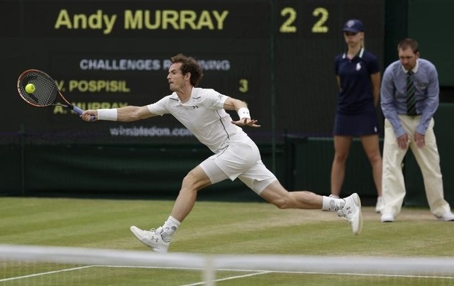 Andy Murray of Britain hits a shot during his match against Vasek Pospisil of Canada at the Wimbledon Tennis Championships in London, July 8, 2015. (REUTERS/Henry Browne)