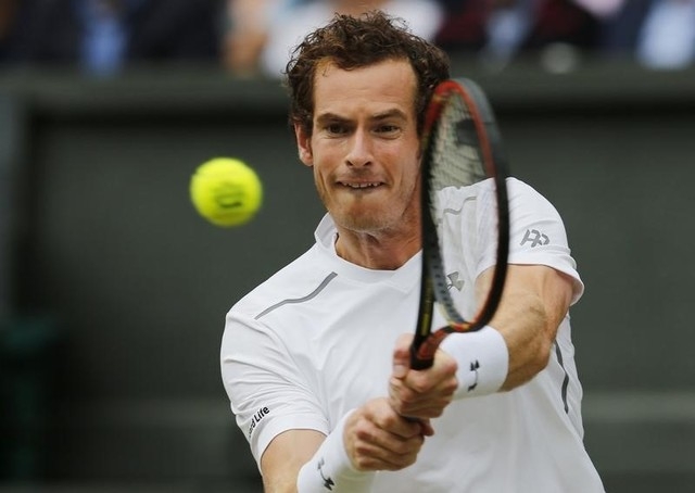 Andy Murray of Britain hits a shot during his match against Vasek Pospisil of Canada at the Wimbledon Tennis Championships in London, July 8, 2015. (REUTERS/Suzanne Plunkett)