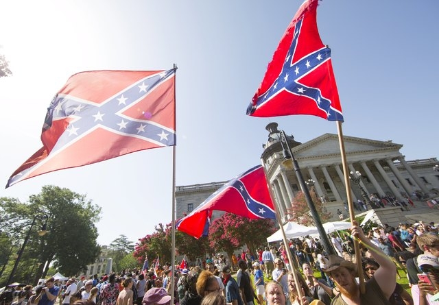 Confederate flag supporters argue their position after the Confederate battle flag was permanently removed from the South Carolina statehouse grounds during a ceremony in Columbia, South Carolina, ...