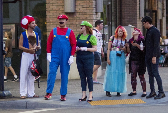 People dressed like characters from the video game Super Mario Bros. wait at a traffic light during the 2015 Comic-Con International Convention in San Diego, California July 10, 2015. (Mario Anzuo ...