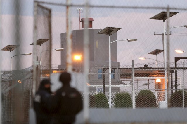 Police keep watch outside the Altiplano Federal Penitentiary, after drug lord Joaquin "El Chapo" Guzman escaped, in Almoloya de Juarez, on the outskirts of Mexico City, July 12, 2015. Guzman escap ...