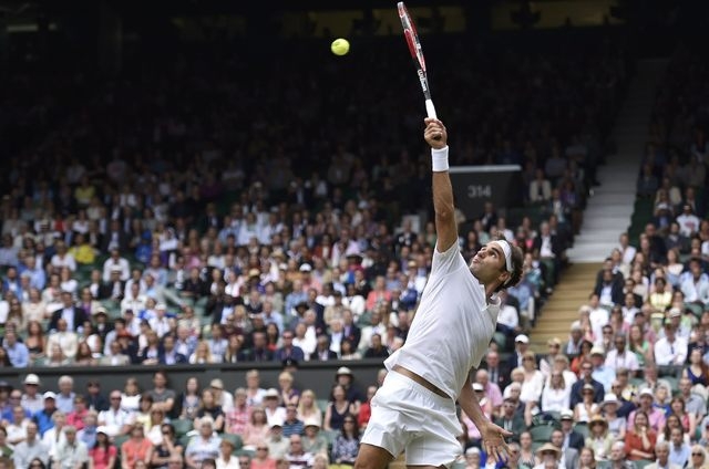 Roger Federer of Switzerland hits a shot during his Men's Singles Final match against Novak Djokovic of Serbia at the Wimbledon Tennis Championships in London, July 12, 2015. (Reuters)