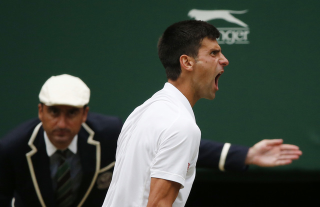 Novak Djokovic of Serbia reacts during his Men's Singles Final match against Roger Federer of Switzerland at the Wimbledon Tennis Championships in London, July 12, 2015.  (Reuters)