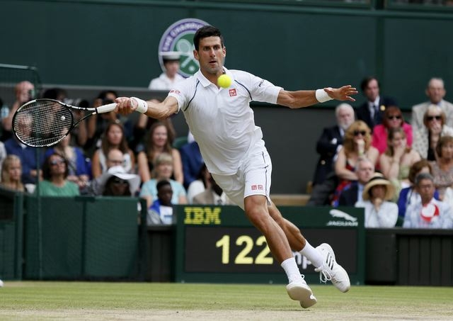 Novak Djokovic of Serbia hits a shot during his Men's Singles Final match against Roger Federer of Switzerland at the Wimbledon Tennis Championships in London, July 12, 2015.  (Reuters)