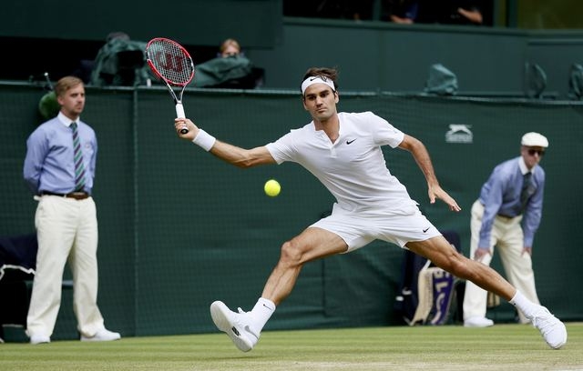 Roger Federer of Switzerland hits a shot during his Men's Singles Final match against Novak Djokovic of Serbia at the Wimbledon Tennis Championships in London, July 12, 2015.    (Reuters)