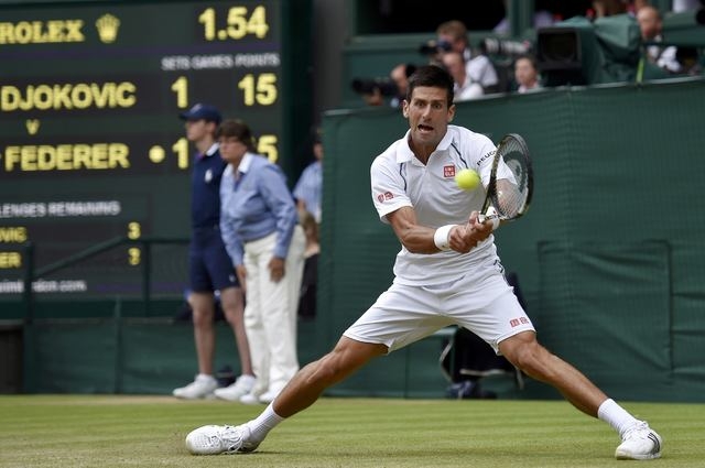 Novak Djokovic of Serbia hits a shot during his Men's Singles Final match against Roger Federer of Switzerland at the Wimbledon Tennis Championships in London, July 12, 2015. (Reuters)