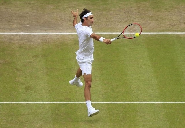 Roger Federer of Switzerland hits a shot during his Men's Singles Final match against Novak Djokovic of Serbia at the Wimbledon Tennis Championships in London, July 12, 2015.   (Reuters)
