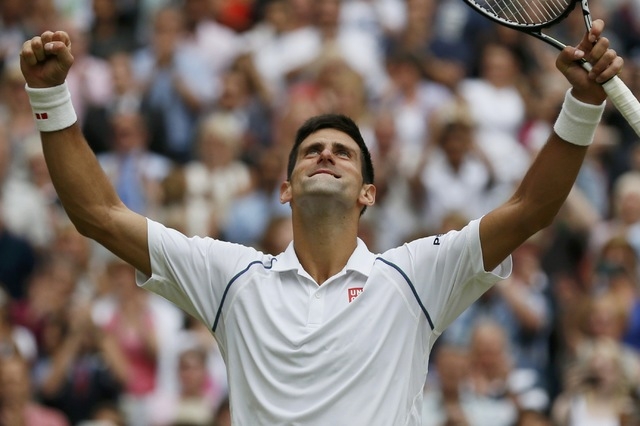 Novak Djokovic of Serbia looks to the sky after winning his Men's Singles Final match against Roger Federer of Switzerland at the Wimbledon Tennis Championships in London, July 12, 2015.  (Reuters)