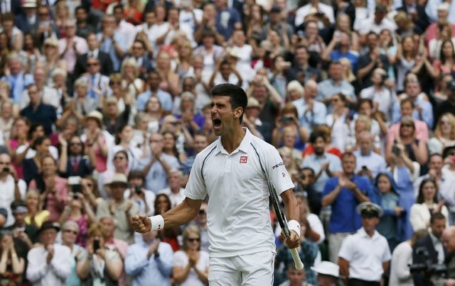 Novak Djokovic of Serbia celebrates after winning his Men's Singles Final match against Roger Federer of Switzerland at the Wimbledon Tennis Championships in London, July 12, 2015.      (Reuters)