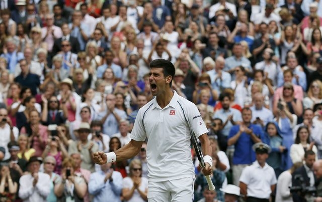 Novak Djokovic of Serbia celebrates after winning his Men's Singles Final match against Roger Federer of Switzerland at the Wimbledon Tennis Championships in London, July 12, 2015. (Reuters)