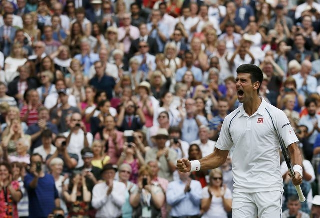 Novak Djokovic of Serbia celebrates after winning his Men's Singles Final match against Roger Federer of Switzerland at the Wimbledon Tennis Championships in London, July 12, 2015.    (Reuters)