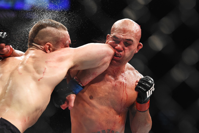 Robbie Lawler has his lip split open by an elbow from Rory Macdonald in their welterweight title fight at UFC 189 Saturday, July 11, 2015 at the MGM Grand Garden Arena in Las Vegas, Nevada. Lawler ...