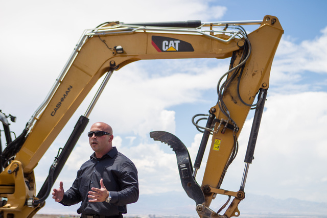 Sales Manager Darin Marques speaks during the groundbreaking of the first home to be built in Ascaya, a luxury home development, in the hills of the McCullough mountain range in Henderson, Nev. on ...