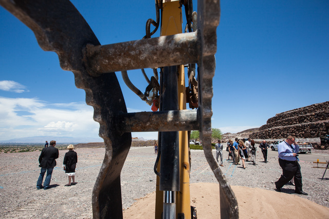 People take in the views before the groundbreaking of the first home to be built in Ascaya, a luxury home development, in the hills of the McCullough mountain range in Henderson, Nev. on Tuesday,  ...