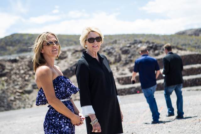Kristi Palmer, left, with Florence Shapiro, surveys the land at the groundbreaking of Palmer's new 11,000 square foot home, the first to be built in Ascaya, a luxury home development, in the hills ...