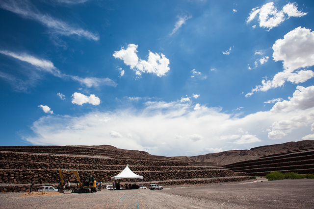 People gather for the groundbreaking of the first home to be built in Ascaya, a luxury home development, in the hills of the McCullough mountain range in Henderson, Nev. on Tuesday, July 7, 2015.  ...