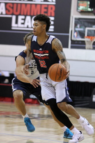 Washington's Kelly Oubre Jr. (12) runs the ball around his opponent in his NBA Summer League game against the NBA Development League team at Cox Pavilion at UNLV in Las Vegas Sunday, July 12, 2015 ...