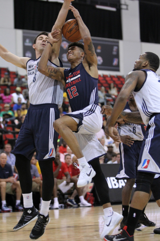 Washington's Kelly Oubre Jr. (12) goes up for a shot against the NBA Development League's 
Daniel Coursey in their NBA Summer League game at Cox Pavilion at UNLV in Las Vegas Sunday, July 12, 2015 ...