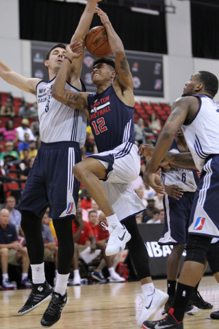 Washington's Kelly Oubre Jr. (12) goes up for a shot against the NBA Development League's
Daniel Coursey in their NBA Summer League game at Cox Pavilion at UNLV in Las Vegas Sunday, July 12, 2015 ...