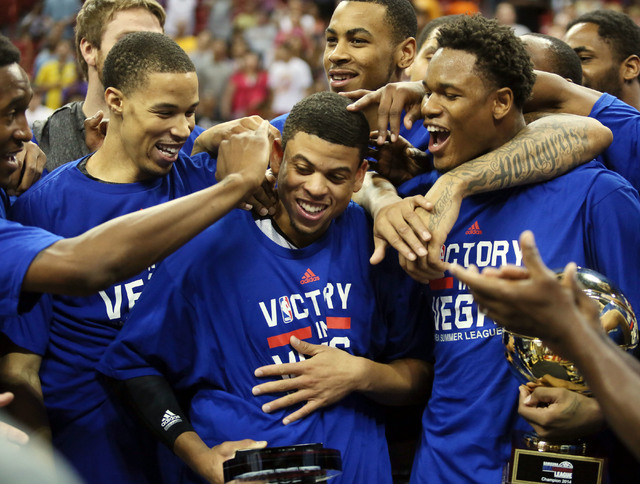 Sacramento’s Ray McCallum, center, celebrates with his teammates after winning the NBA Summer League championship game 77-68 against Houston at the Thomas & Mack Center Monday, July 21, 201 ...