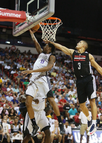 Sacramento’s MarShon Brooks, left, goes up for a shot as Houston's Nick Johnson blocks during an NBA Summer League championship game at the Thomas & Mack Center Monday, July 21, 2014, in La ...
