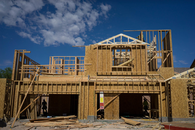 Construction workers build a town house on Irene Porter Street in North Las Vegas on Monday, June 29, 2015. Ryland Homes' Centennial Crossings is one of the newest town home communities in the val ...