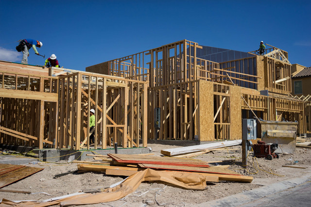 Construction workers build a town house on Irene Porter Street in North Las Vegas on Monday, June 29, 2015. Ryland Homes' Centennial Crossings is one of the newest town home communities in the val ...