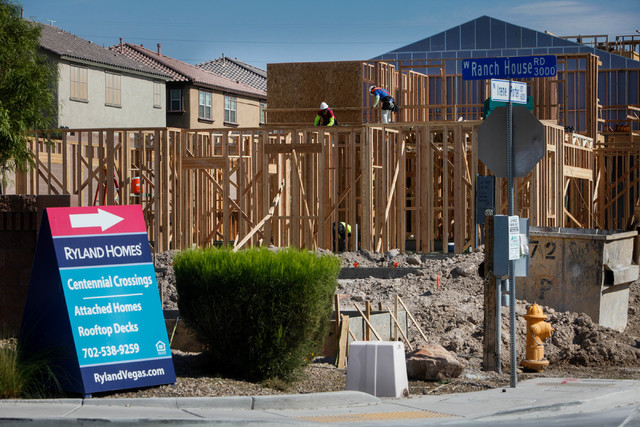 Construction workers build a town house on Irene Porter Street in North Las Vegas on Monday, June 29, 2015. Ryland Homes' Centennial Crossings is one of the newest town home communities in the val ...