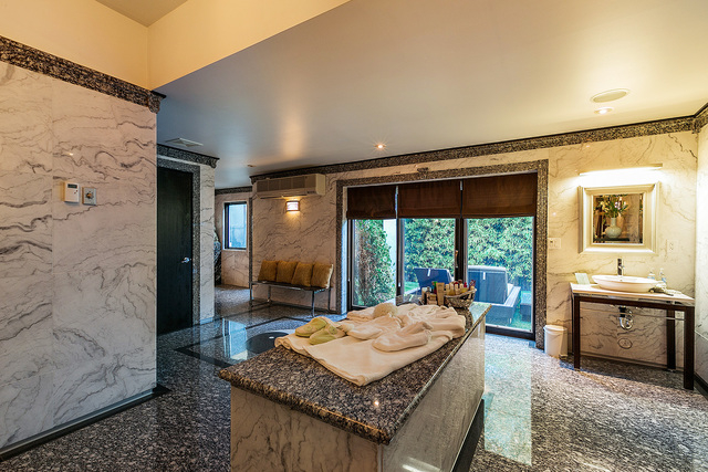 One of the seven bathrooms has been converted into a spa with a heated massage table, sauna and steam room. (Courtesy photo)