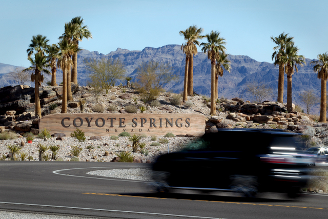 A vehicle passes the entrance of Coyote Springs developmet, located on U.S. 93 about 60 miles northeast of Las Vegas,Tuesday, March 20, 2012. The 40,000 acre development and was planning on buildi ...