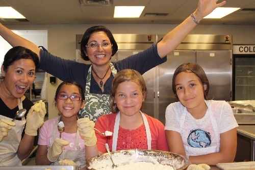 Summerlin-area resident Giovanna Raccosta stands with volunteers for the Dinner On Us program at the Las Vegas Rescue Mission, which she started in 2011, in this undated photo. (View file photo)