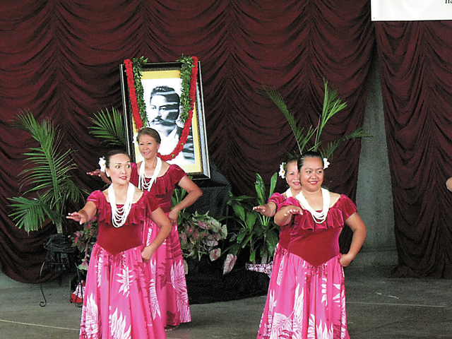 Hula dancers perform near a shrine set up in honor of Hawaiian Civic Club founder Prince Jonah Kuhio during the 20th annual Prince Jonah Kuhio Ho’olaule’a Pacific Islands Festival at the Hende ...