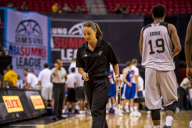 Becky Hammon, the coach of the San Antonio Spurs, walks back to the bench while her team plays the New York Knicks during the NBA Summer League at the Thomas & Mack Center in Las Vegas on Saturday ...