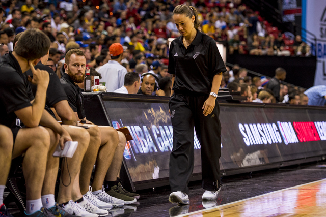 Becky Hammon, the coach of the San Antonio Spurs, walks back to the bench while her team plays the New York Knicks during the NBA Summer League at the Thomas & Mack Center in Las Vegas on Saturday ...