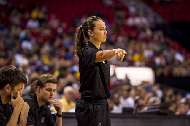Becky Hammon, the coach of the San Antonio Spurs, points down court while her team plays the New York Knicks during the NBA Summer League at the Thomas & Mack Center in Las Vegas on Saturday, July ...