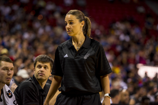 Becky Hammon, the coach of the San Antonio Spurs, walks down the bench while her team plays the New York Knicks during the NBA Summer League at the Thomas & Mack Center in Las Vegas on Saturday, J ...