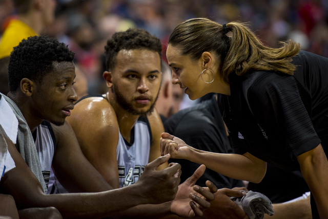 Becky Hammon, the coach of the San Antonio Spurs, talks to Cady Lalanne (26), left, and Kyle Anderson (1) while her team plays the New York Knicks during the NBA Summer League at the Thomas & Mack ...