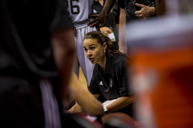 Becky Hammon, the coach of the San Antonio Spurs, talks to her team while they play the New York Knicks during the NBA Summer League at the Thomas & Mack Center in Las Vegas on Saturday, July 11,  ...