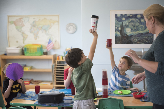 Students at Mountain Heights Montessori in Las Vegas play with their water containers during lunch, Wednesday, July 1, 2015.(Jason Ogulnik/Las Vegas Review-Journal)