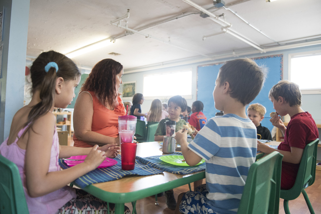 Heather Brazell, second from left, teacher at Mountain Heights Montessori in Las Vegas, sits with her students during lunch, Wednesday, July 1, 2015.(Jason Ogulnik/Las Vegas Review-Journal)