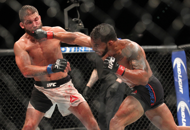 Dennis Bermudez, right, throws a jab at Jeremy Stephens during UFC 189 at the MGM Grand Garden Arena Saturday, July 11, 2015, in Las Vegas. Stephens won by knockout. (Chase Stevens/Las Vegas Revie ...
