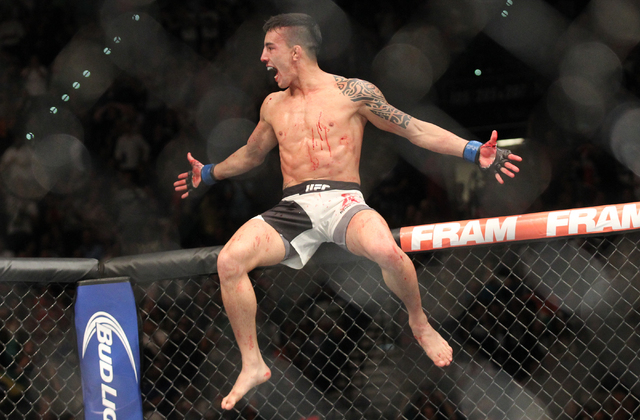 Thomas Almeida celebrates after defeating Brad Pickett during UFC 189 at the MGM Grand Garden Arena Saturday, July 11, 2015, in Las Vegas. (Chase Stevens/Las Vegas Review-Journal) Follow Chase Ste ...