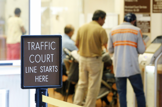 People are seen at the Municipal Court payment counter on the first floor of Regional Justice Center on Friday, June 12, 2015. (Bizuayehu Tesfaye/Las Vegas Review-Journal) Follow Bizu Tesfaye on ...