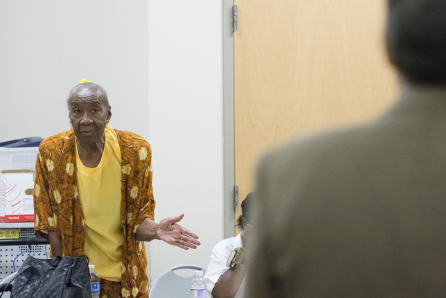 Annie L. Walker directs a question to Cass Palmer, North Las Vegas director of Neighborhood and Leisure Services, at Dr. William U. Pearson Community Center in North Las Vegas, Saturday, July 11,  ...