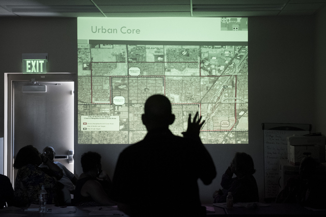 North Las Vegas neighborhood services coordinator Jim Haye, center, projects the area slated for the Choice Neighborhood Grant on the wall during North Valley Leadership Team's meeting at Dr. Wil ...