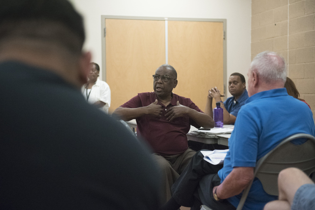 Gene Collins, center, addresses a question to Melanie Braud, development and modernization coordinator, during North Valley Leadership Team's meeting at Dr. William U. Pearson Community Center in ...