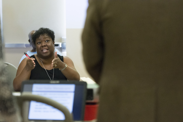 Lydia Garrett directs a question to Cass Palmer, North Las Vegas director of Neighborhood and Leisure Services, at Dr. William U. Pearson Community Center in North Las Vegas, Saturday, July 11, 20 ...